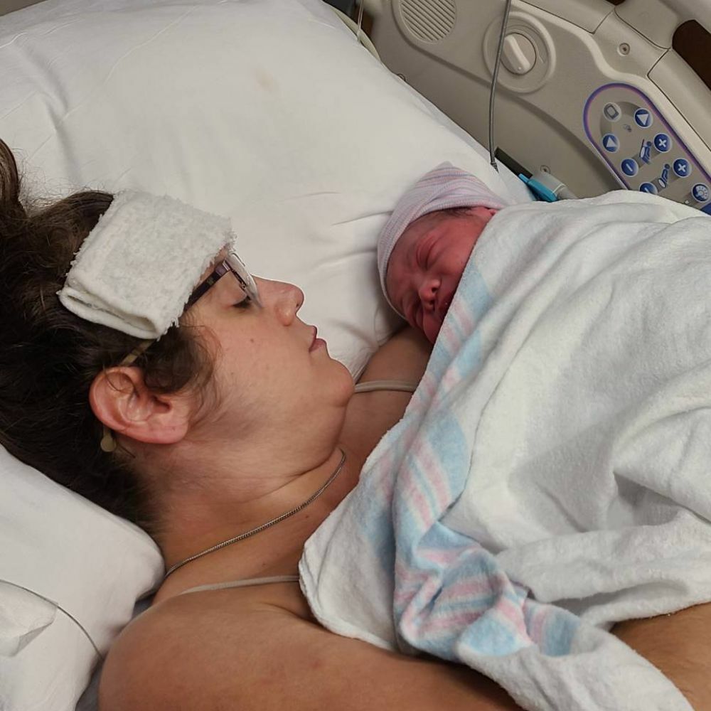 woman holding newborn baby